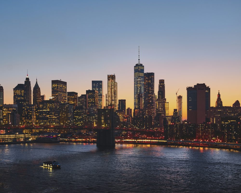 A horizontal shot of New York cityscape, with the Brooklyn Bridge over the East River in the shot. Perfect for depicting Brooklyn Bridge or New York.